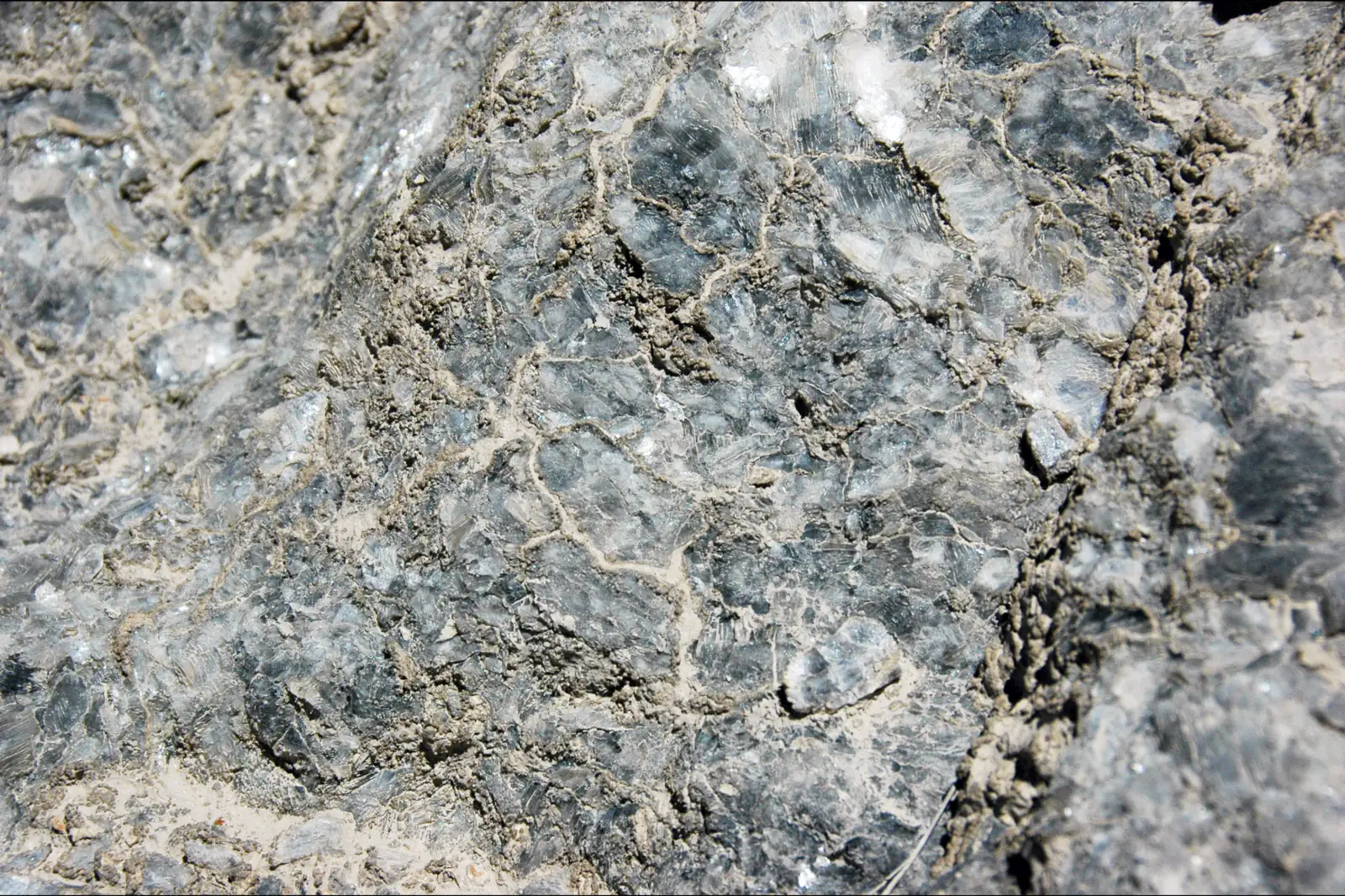 Close-up of natural rock gypsum with grey and white crystalline texture