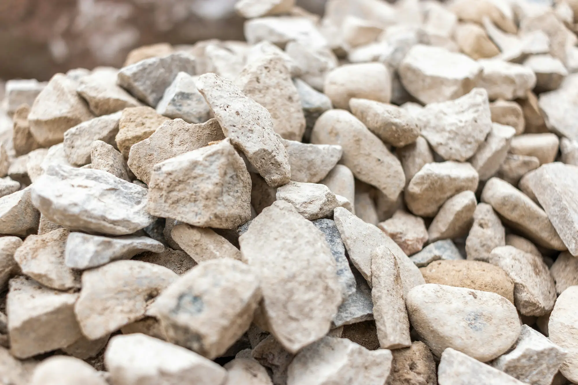 Close-up of a pile of pale cream crushed limestone